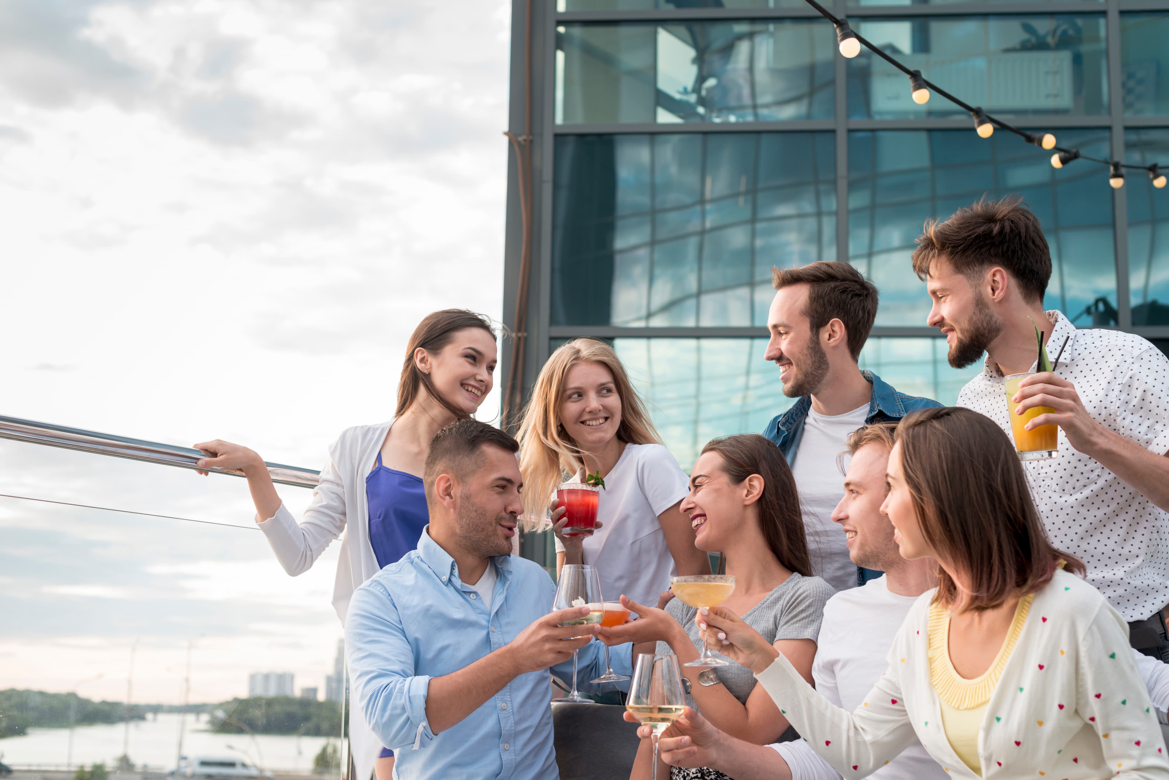 Guests toasting together at a terrace party